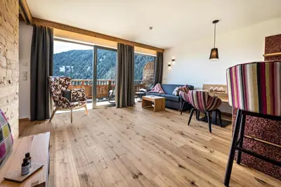 a living room with a view of a mountain at MULIN Appartements in Valles
