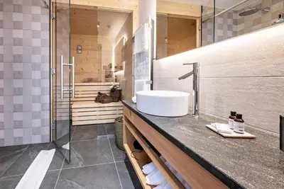 a bathroom with a sink and a shower at MULIN Appartements in Valles