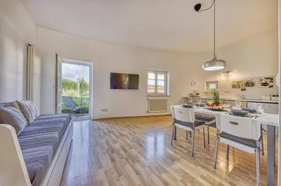 a living room with a couch and a table at HOMESTWENTY3 - Home four in Caldaro