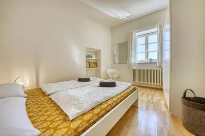 a bedroom with two beds and a window at HOMESTWENTY3 - Home four in Caldaro