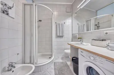 a bathroom with a shower sink and a toilet at HOMESTWENTY3 - Home four in Caldaro