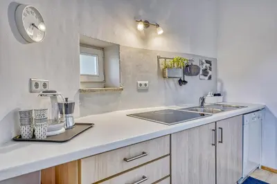 a kitchen with a sink and a counter top at HOMESTWENTY3 - Home four in Caldaro