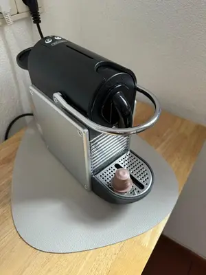 a coffee maker sitting on top of a table at Apartments Oberhollenzer in Braies