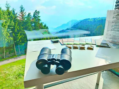a pile of binoculars sitting on top of a table at Vidora Apartments in Soprabolzano