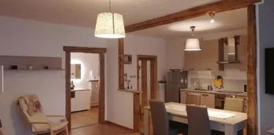 a kitchen and dining room with a table and chairs at Appartamento 