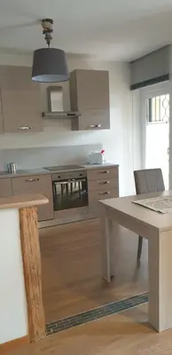 a kitchen with a table and a stove at Appartamento 