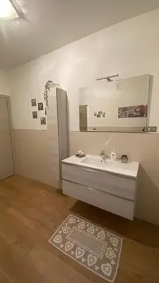a bathroom with a toilet and a sink at Appartamento 