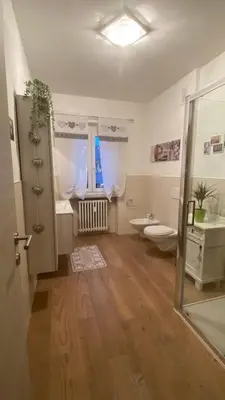 a bathroom with a shower and a toilet at Appartamento 