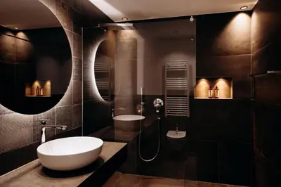 a bathroom with a white sink and a mirror at Dolomites Chalet Niuasi in Ortisei