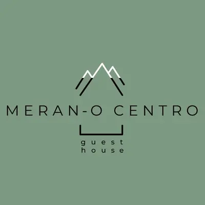 a mountain logo with the words mergan ogemo at Meran/o Centro Guest House in Merano