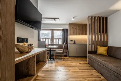 a living room with a couch and a table at Niciora in Badia