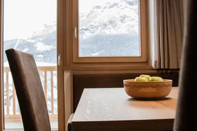 a bowl of apples on a table in front of a window at Niciora in Badia