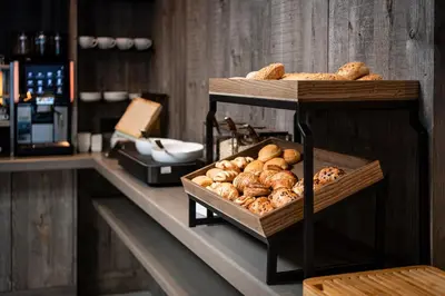 a shelf with a bunch of bread on it at Surega - Idyllic Farmhouse in San Cassiano