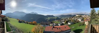 a view of a village with mountains in the background at Apartment La Brunella in Laion