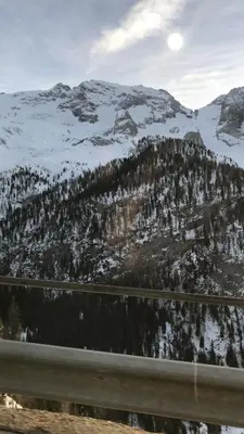 a view of a snow covered mountain with a highway at SUITE25 GOLFHOTEL in Carezza al Lago