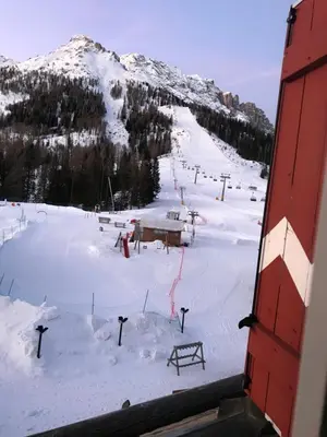 a view of a ski slope with a ski lift at SUITE25 GOLFHOTEL in Carezza al Lago