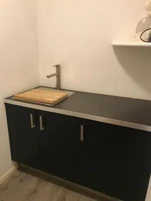 a kitchen counter with a sink on top of it at SUITE25 GOLFHOTEL in Carezza al Lago