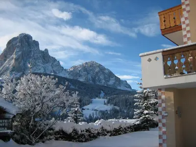 a view of the mountains from a balcony of a building at Apartments Etruska in Santa Cristina in Val Gardena