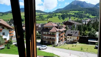 a view of a town from a window at Casa Tura San Vigilio in San Vigilio Di Marebbe