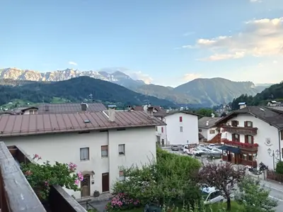 a view of a town with mountains in the background at La Mansarda di Sabina. in Fiera di Primiero