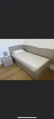 a white couch in a room with a side table at Azalea in Cornaiano
