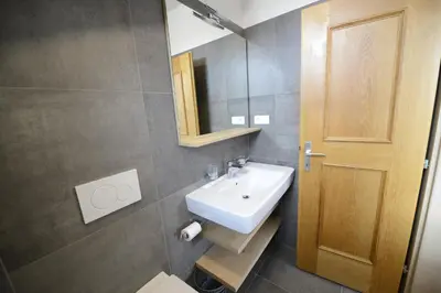 a bathroom with a sink and a mirror at Residence BADLEIT in Lagundo