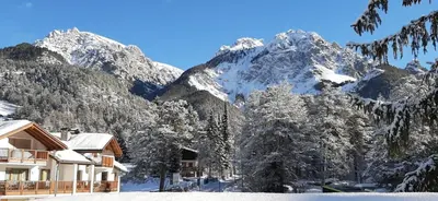 a ski lodge in the mountains with snow at Les Corcelles in San Vigilio Di Marebbe