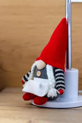 a santa claus toy is sitting on a lightswitch at Apartment Sabrina in Santa Cristina in Val Gardena