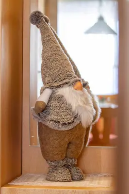 a stuffed animal is standing in front of a mirror at Apartment Sabrina in Santa Cristina in Val Gardena