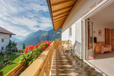 a balcony with a view of mountains at Appartements Verdinserhöhe in Schenna