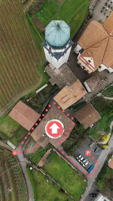 an aerial view of a building with a sign in front at Privatzimmervermietung Messner in Rifiano