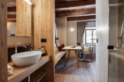 a bathroom with a large white bowl sink on a counter at Lüch Colz in Badia
