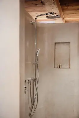a shower in a bathroom with a shower head at Lüch Colz in Badia