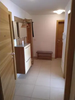 a small room with a refrigerator and a bench at Appartement Alois in Bressanone