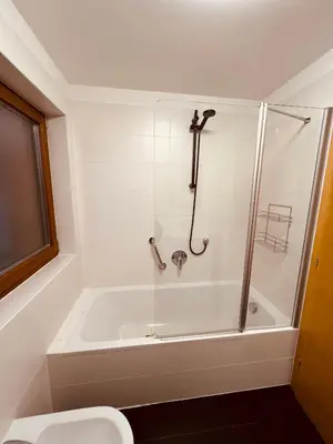 a bathroom with a shower and a bath tub at Appartement Alois in Bressanone