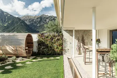 a garden with a view of the mountains at Romy & Johannes Guesthouse in Schenna