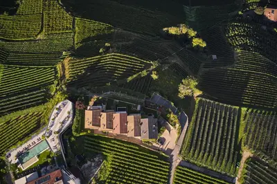 an overhead view of a building in a field of crops at Romy & Johannes Guesthouse in Schenna