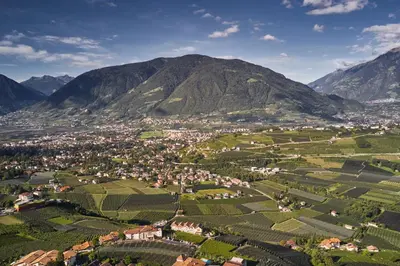 an aerial view of a village in the mountains at Romy & Johannes Guesthouse in Schenna