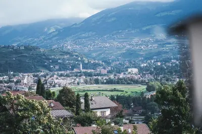 a view of a town in the mountains at Der Ruibacher in Marlengo