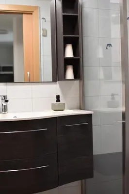 a bathroom with a sink and a mirror and a shower at Ferienwohnungen Pircher in Rablà