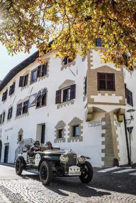 an old car parked in front of a building at Ansitz Grustdorf in Appiano sulla Strada del Vino