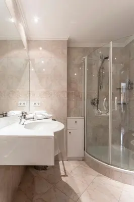 a bathroom with a sink and a shower at Residence Castel in Ortisei