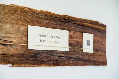 a piece of wood with a sign on it at Gasthof Wunder in Auna di Sotto