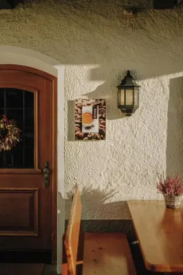 a door of a house with a picture on the wall at Gasthof Wunder in Auna di Sotto
