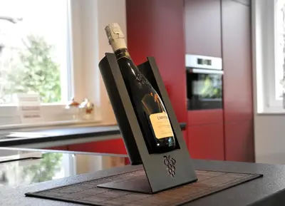 a bottle of wine in a holder on a counter at Ruhige Ferienwohnung mit Garten und Garage in Privatvilla in Marlengo