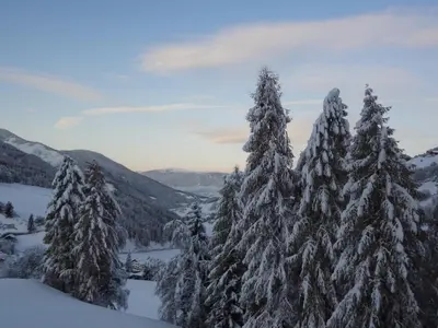 a cabin in the middle of a snowy mountain at Apartments Kaserott in Villnoss