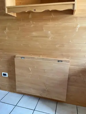 a room with wooden tables and benches in a room at CIASA SORES in Moena