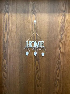 a wooden door with a home sign on it at CIASA SORES in Moena