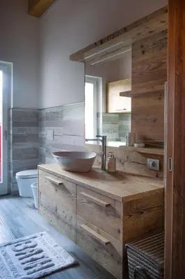 a bathroom with a bowl sink on a wooden counter at Pigala Al Drit in Rivamonte