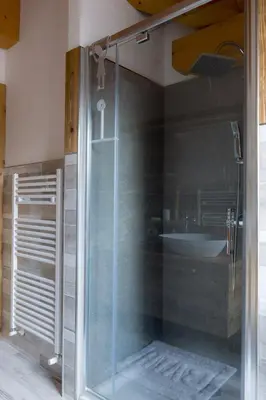 a glass shower in a bathroom with a sink at Pigala Al Drit in Rivamonte